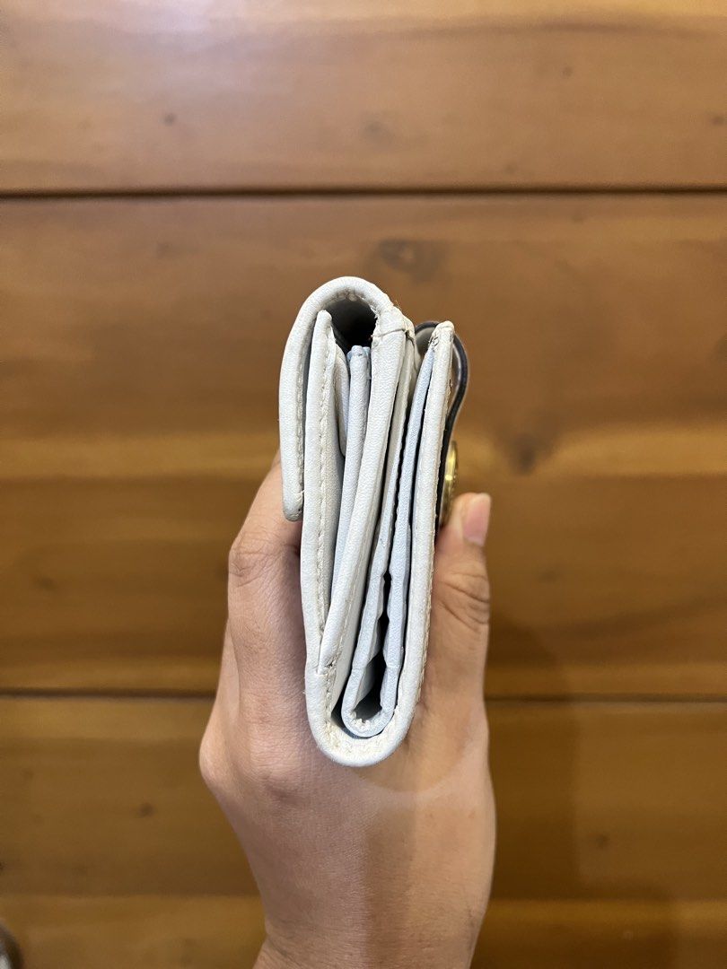 Coach White Monogram Tattersall Bifold Snap Closure 2 Compartment Wallet (Category: Luxury Bags & Wallets) located in Quezon City. Submitted by prebyflo (Listing ID 1459852037, Image 3). Description: 100% authentic Bought in Japan Tattersall lining 💘 8/10 overall condition Normal wears for a vintage wallet See last photo for minor rubs on the corners Has 8 card slots With a dedicated coin purse 💗 No other issues! .
