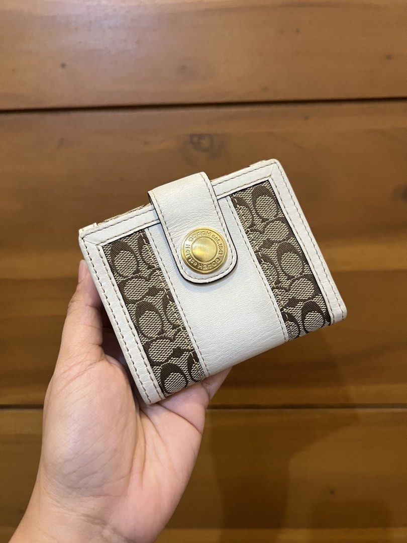 Coach White Monogram Tattersall Bifold Snap Closure 2 Compartment Wallet (Category: Luxury Bags & Wallets) located in Quezon City. Submitted by prebyflo (Listing ID 1459852037, Image 1). Description: 100% authentic Bought in Japan Tattersall lining 💘 8/10 overall condition Normal wears for a vintage wallet See last photo for minor rubs on the corners Has 8 card slots With a dedicated coin purse 💗 No other issues! .