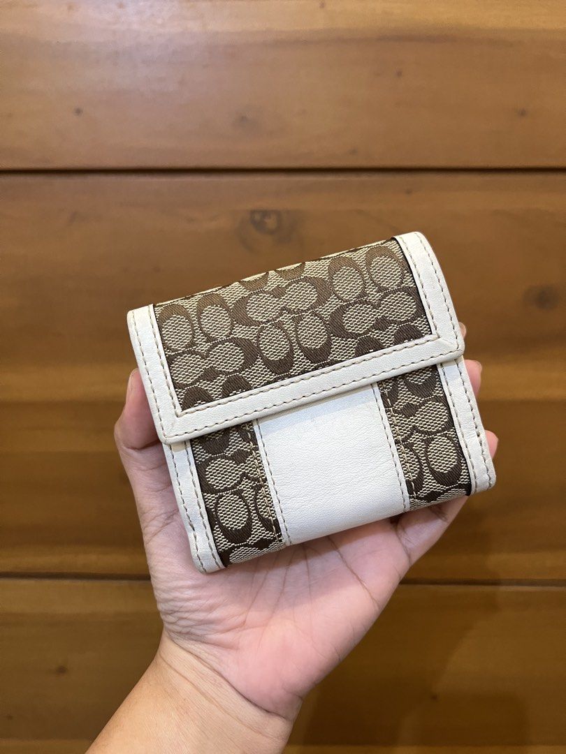 Coach White Monogram Tattersall Bifold Snap Closure 2 Compartment Wallet (Category: Luxury Bags & Wallets) located in Quezon City. Submitted by prebyflo (Listing ID 1459852037, Image 2). Description: 100% authentic Bought in Japan Tattersall lining 💘 8/10 overall condition Normal wears for a vintage wallet See last photo for minor rubs on the corners Has 8 card slots With a dedicated coin purse 💗 No other issues! .