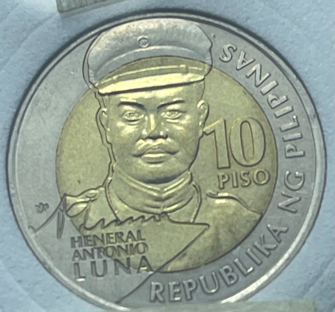2016 Ten Piso Commemorative coin (Category: Currency) located in Mandaluyong City. Submitted by brightbear_6d8f63 (Listing ID 1459817001, Image 1). Description: Philippines National Hero, Gen. Antonio Luna who fought the Americans during the American occupation of the Philippines..