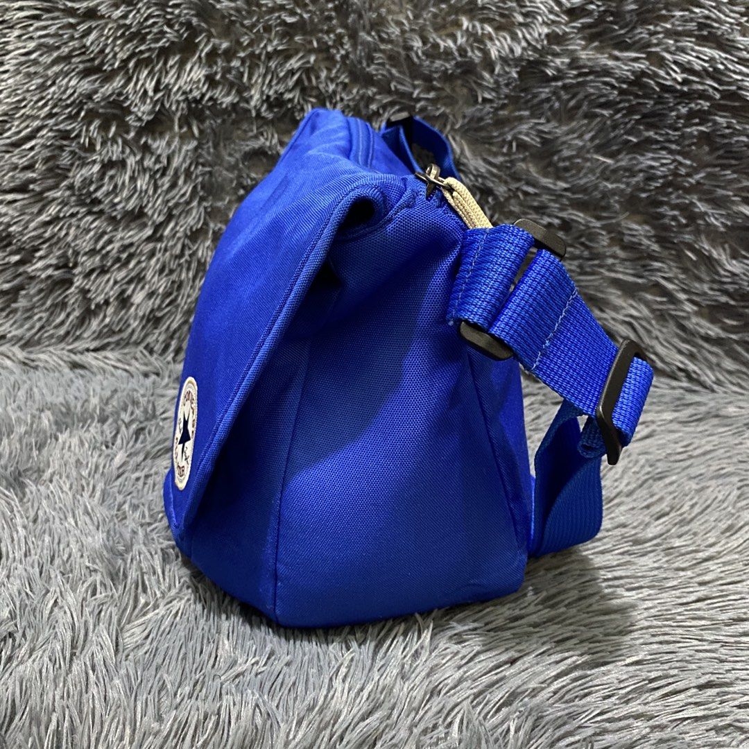 Converse messenger bag (Category: Belt bags, Clutches and Pouches) located in Manila. Submitted by saint.m (Listing ID 1459780839, Image 2). Description: Messenger bag Length: 11 inches Width: 14 inches Condition: 9/10 Color rate: 9.5/10 .