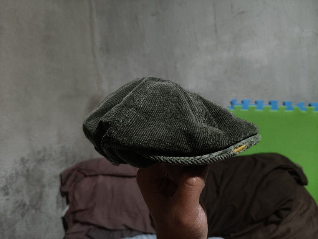 Corduroy Flat Cap Hat - Olive Green (Category: Caps & Hats) located in Bacolod City. Submitted by rymndslais (Listing ID 1459815434, Image 3). Description: - Olive green corduroy flat cap - Classic newsboy style - Features a small yellow tag on the side - Great for casual wear or a vintage aesthetic - Youth size until 12 y.o - Note: Shows some signs of wear on the brim.