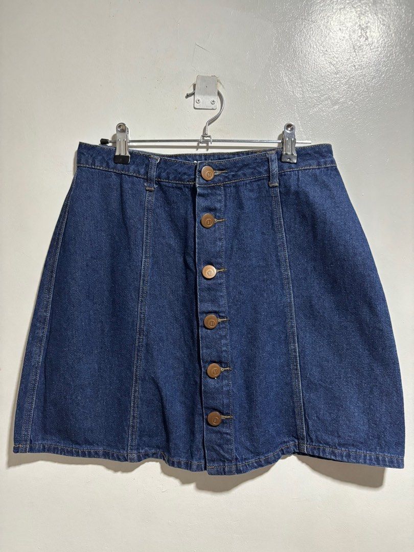 Cotton On Denim Skirt (Category: Skirts) located in Cavite. Submitted by aceepreeloved (Listing ID 1459783408, Image 1). Description: - Cotton On denim skirt - A-line silhouette - Dark wash - Button-down front - Size: AUS 10, USA 6, EUR 38 - Perfect for casual wear - Made in China Waist: 14 in Hips: 20 in Length: 17 in.