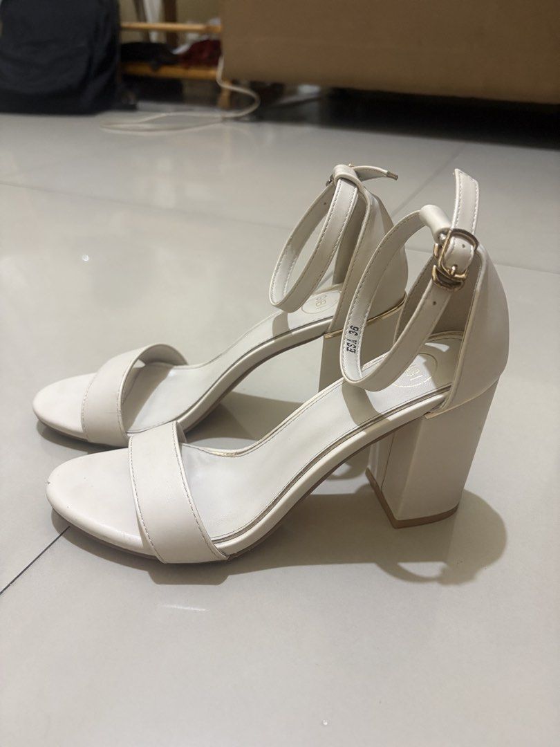 Cream Ankle Strap Block Heels (Category: Heels) located in Manila. Submitted by kuroe.preloved (Listing ID 1459882706, Image 1). Description: - Cream colored block heels - Size 36 - Chunky heel for comfort - Ankle strap with gold buckle closure - Versatile for dressing up outfits - Used less than 5 times - Bought it for ₱1,899 - Price negotiable .