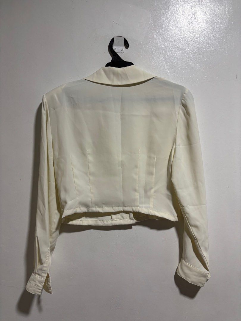 Cream colored Crop Polo Top (Category: Blouses) located in Cavite. Submitted by aceepreeloved (Listing ID 1459778916, Image 2). Description: Size: Small-Medium Pit to pit (Width): 18.5 in Waist: 15.5 in Length: 16.5 in Arm seam: 16 in Shoulder: 17 in (Note: Please know and check your measurements. I cannot, most of the time, provide “when worn” because of my job. Please bear with me.) RFS: Decluttering Mode of Payment (MOP): GCash or Maribank Mod