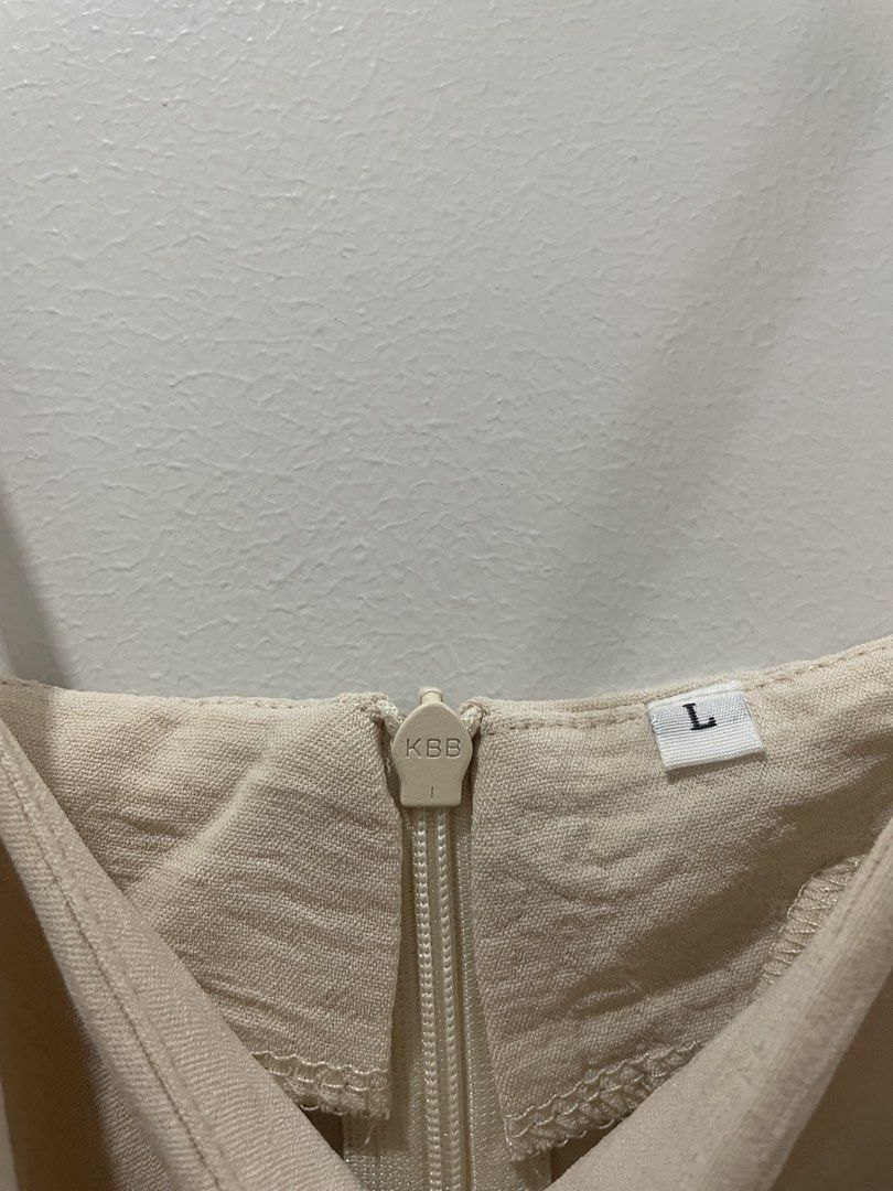 Cream Linen Dress (Category: Dresses) located in Binan City. Submitted by dearlouise (Listing ID 1459784938, Image 2). Description: - Cream slip dress from KBB - Adjustable straps - Zipper closure at the back - Textured fabric finish - Versatile for layering or wearing alone.