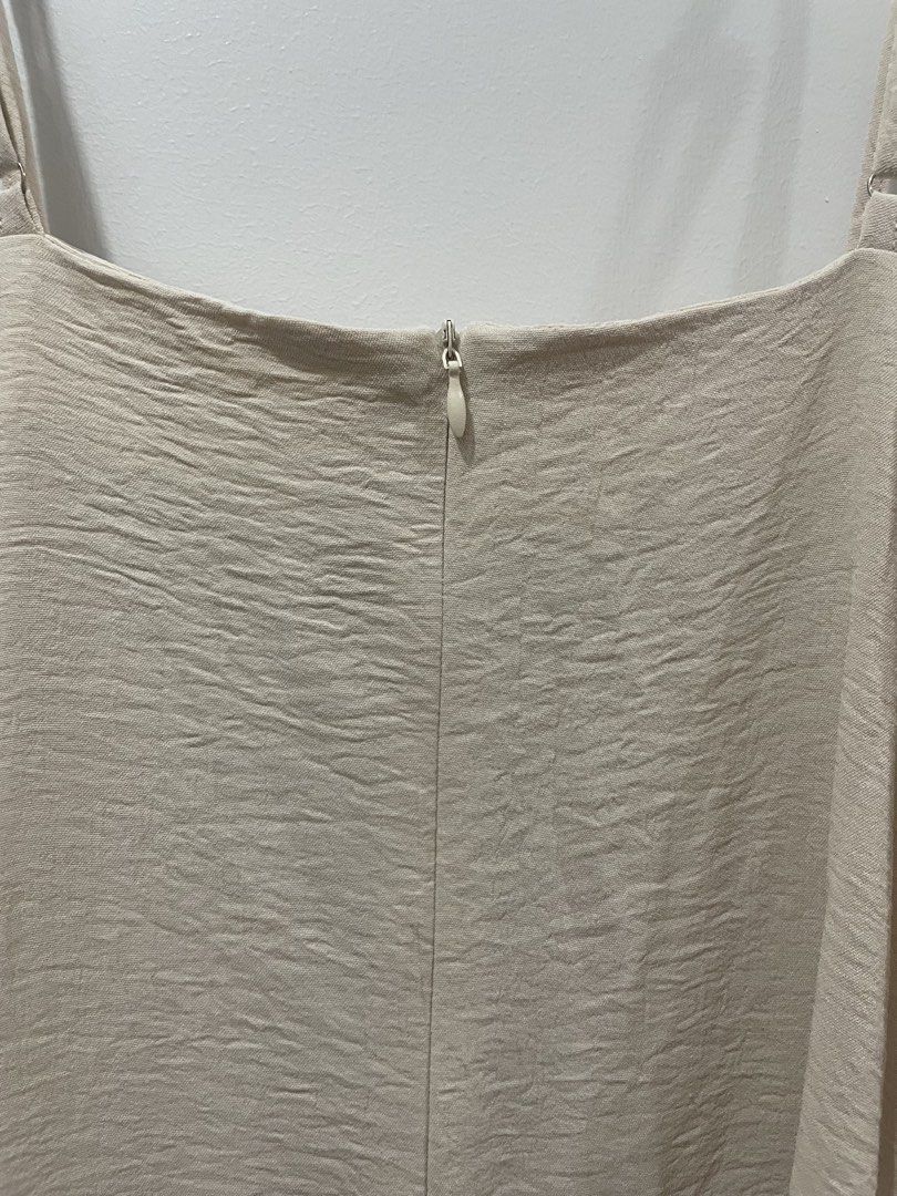 Cream Linen Dress (Category: Dresses) located in Binan City. Submitted by dearlouise (Listing ID 1459784938, Image 3). Description: - Cream slip dress from KBB - Adjustable straps - Zipper closure at the back - Textured fabric finish - Versatile for layering or wearing alone.