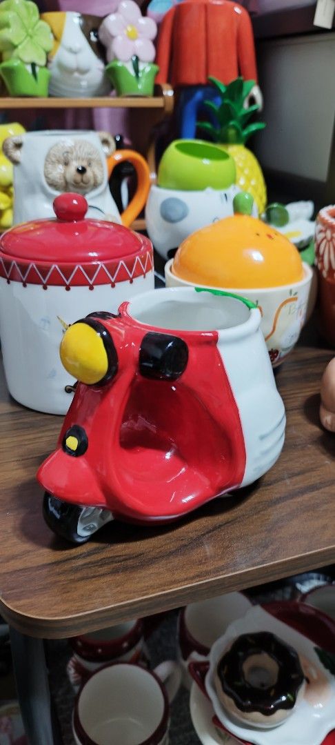 Cute Scooter Shaped Mug - Red, White, and Green (Category: Coffee & Tea Tableware) located in Manila. Submitted by silverwhale_cafa21 (Listing ID 1459844544, Image 1). Description: - Fun mug shaped like a vintage scooter - Features a red, white, and green design - Ideal for enjoying coffee or tea - Unique collectible item - Makes a great gift or kitchen accent - Holds a generous amount of liquid.