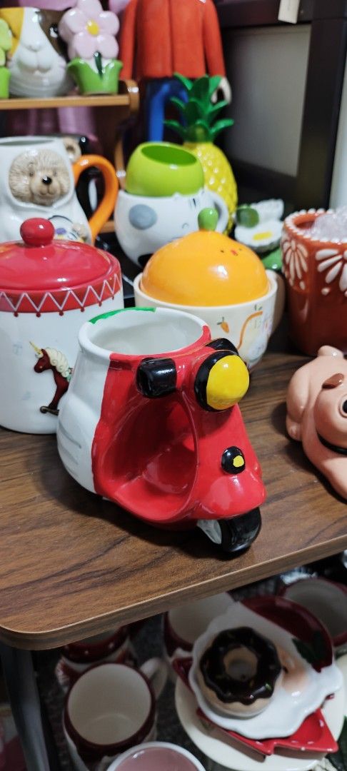 Cute Scooter Shaped Mug - Red, White, and Green (Category: Coffee & Tea Tableware) located in Manila. Submitted by silverwhale_cafa21 (Listing ID 1459844544, Image 2). Description: - Fun mug shaped like a vintage scooter - Features a red, white, and green design - Ideal for enjoying coffee or tea - Unique collectible item - Makes a great gift or kitchen accent - Holds a generous amount of liquid.