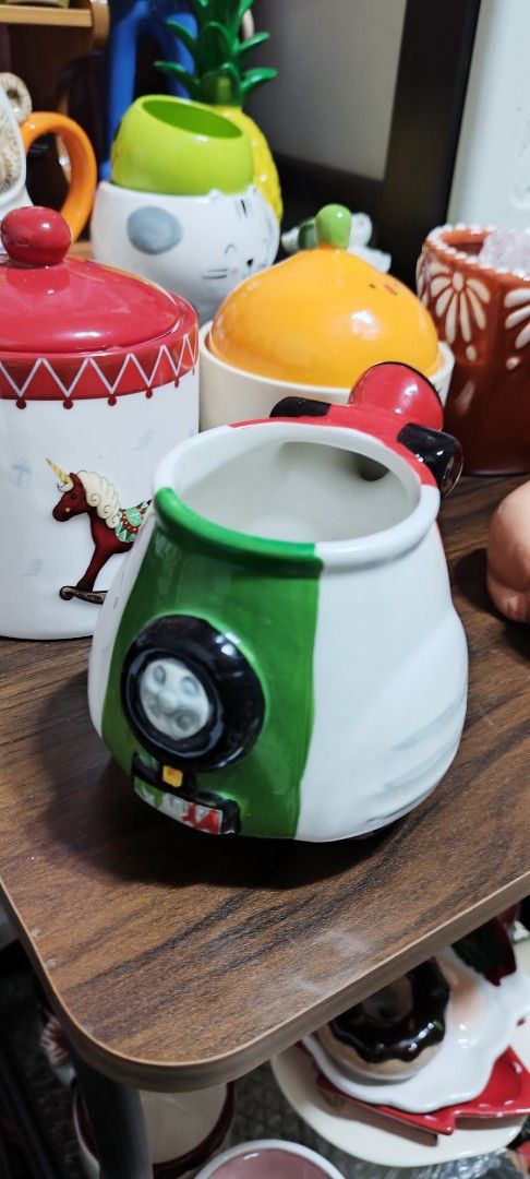 Cute Scooter Shaped Mug - Red, White, and Green (Category: Coffee & Tea Tableware) located in Manila. Submitted by silverwhale_cafa21 (Listing ID 1459844544, Image 3). Description: - Fun mug shaped like a vintage scooter - Features a red, white, and green design - Ideal for enjoying coffee or tea - Unique collectible item - Makes a great gift or kitchen accent - Holds a generous amount of liquid.