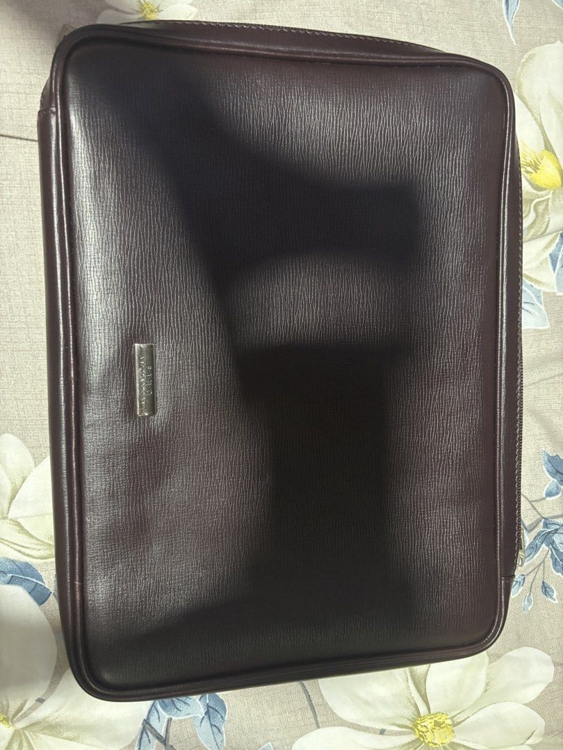 Dark Brown Leather Document Holder (Category: Wallets & Card holders) located in Pasig City. Submitted by johndarell47046 (Listing ID 1459757392, Image 1). Description: - Dark brown leather document holder - Zipper closure all around - Small metal plate detail on the front - Ideal for organizing papers or a tablet - Approximate dimensions: 10 inches x 13 inches.