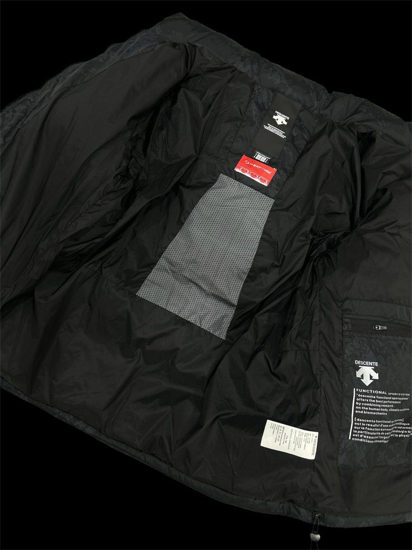 Descente x Audi Swiss Ski Team Puffer Jacket (Category: Coats, Jackets and Outerwear) located in Manila. Submitted by bodegabodega (Listing ID 1459772110, Image 2). Description: - Authentic Descente puffer jacket - Official Swiss Ski Team gear - Multiple sponsor patches: Raiffeisen, Helvetia, BKW, Sunrise, Audi - Features Audi rings and Swiss Ski logos - Subtle patterned exterior - Black inner lining with patterned panel - Descente branded zipper