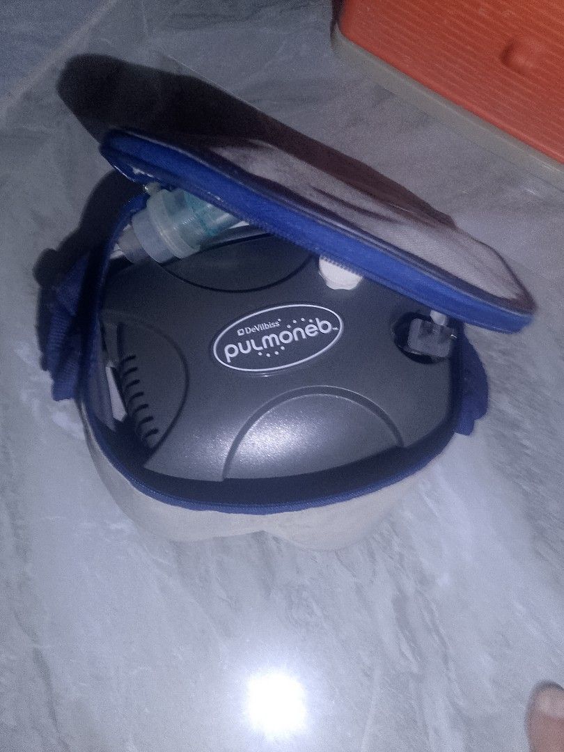 DeVilbiss Pulmonneb Nebulizer with Carrying Case (Category: Medical Supplies & Tools) located in Manila. Submitted by jhayden28 (Listing ID 1459854101, Image 1). Description: - DeVilbiss Pulmonneb nebulizer - Comes with a blue carrying case - Includes nebulizer cup and tubing - Perfect for respiratory treatments - Easy to transport and store - Ready for its new owner.