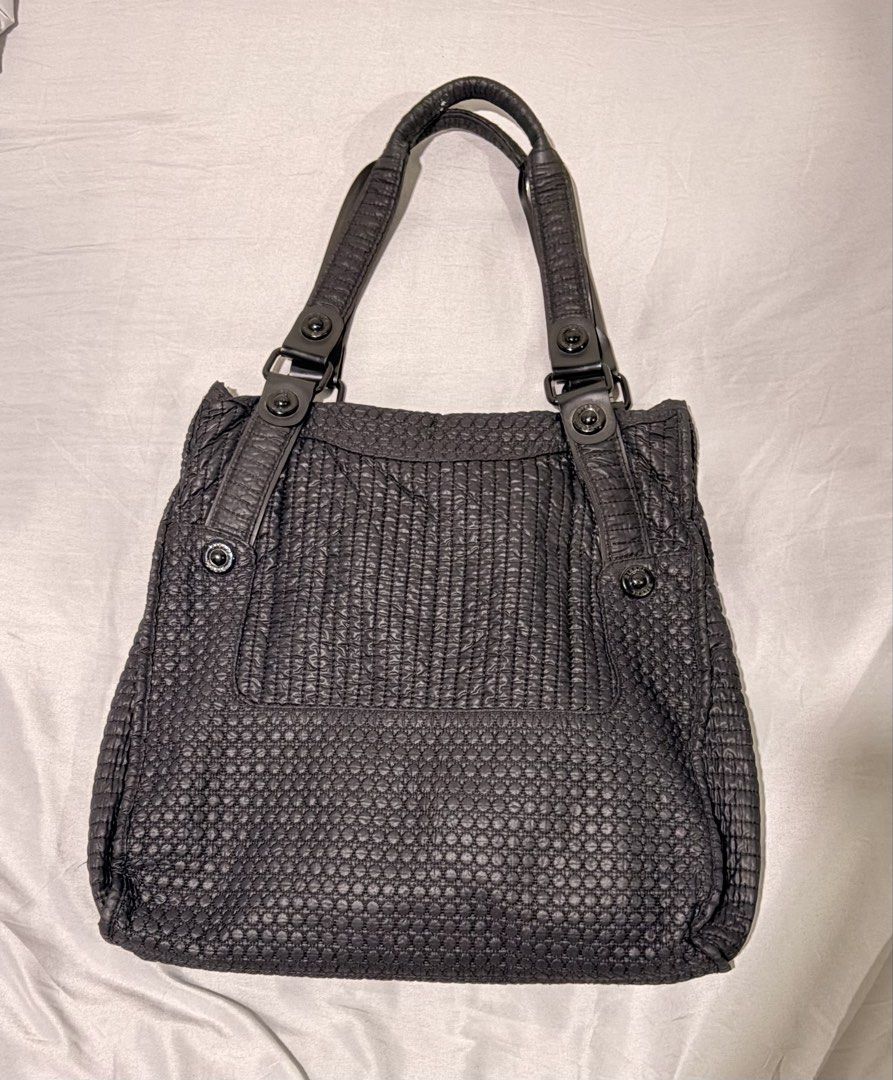 Diesel Black Quilted Textured Shoulder Bag (Category: Shoulder Bags) located in Manila. Submitted by urban.refinds (Listing ID 1459779011, Image 3). Description: - Authentic Black Diesel Shoulder Bag - Elegant textured quilted design - Convenient front flap pocket with snap closure - Dual top handles with adjustable straps - Sleek dark hardware accents - Ample interior space for your essentials - Ideal for everyday wear - Still negotiable.