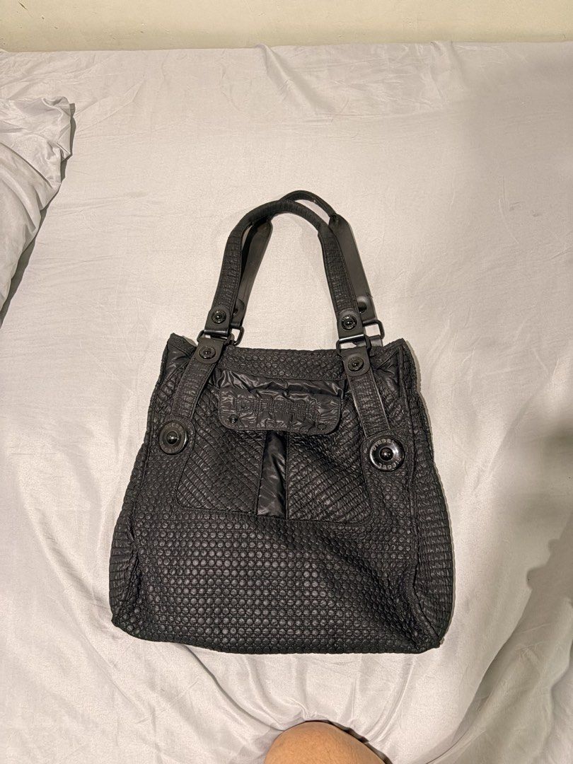 Diesel Black Quilted Textured Shoulder Bag (Category: Shoulder Bags) located in Manila. Submitted by urban.refinds (Listing ID 1459779011, Image 2). Description: - Authentic Black Diesel Shoulder Bag - Elegant textured quilted design - Convenient front flap pocket with snap closure - Dual top handles with adjustable straps - Sleek dark hardware accents - Ample interior space for your essentials - Ideal for everyday wear - Still negotiable.