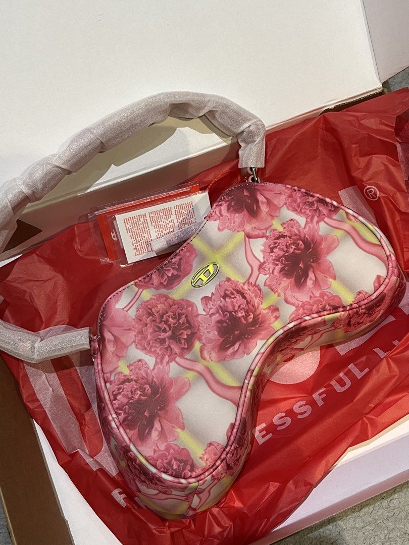 Diesel Pink Play Shoulder-Asymmetric bag (Category: Luxury Bags & Wallets) located in Baguio. Submitted by franniedoll (Listing ID 1459754994, Image 1). Description: - adjustable shoulder bag ! can make the straps longer <3 - bought in 2023 iirc, at diesel.es site (i’m from madrid) - rfs: my absolute baby cuz i bought her as memorabilia for getting a job lol but i don’t use her :( haven’t even used her 5 times. just been hung up since i got back 