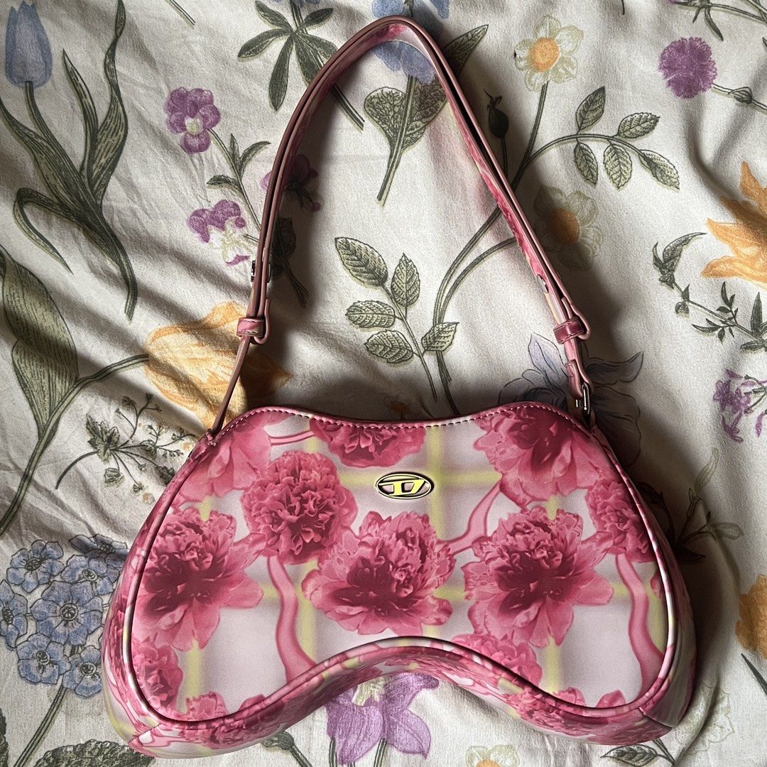 Diesel Pink Play Shoulder-Asymmetric bag (Category: Luxury Bags & Wallets) located in Baguio. Submitted by franniedoll (Listing ID 1459754994, Image 2). Description: - adjustable shoulder bag ! can make the straps longer <3 - bought in 2023 iirc, at diesel.es site (i’m from madrid) - rfs: my absolute baby cuz i bought her as memorabilia for getting a job lol but i don’t use her :( haven’t even used her 5 times. just been hung up since i got back 
