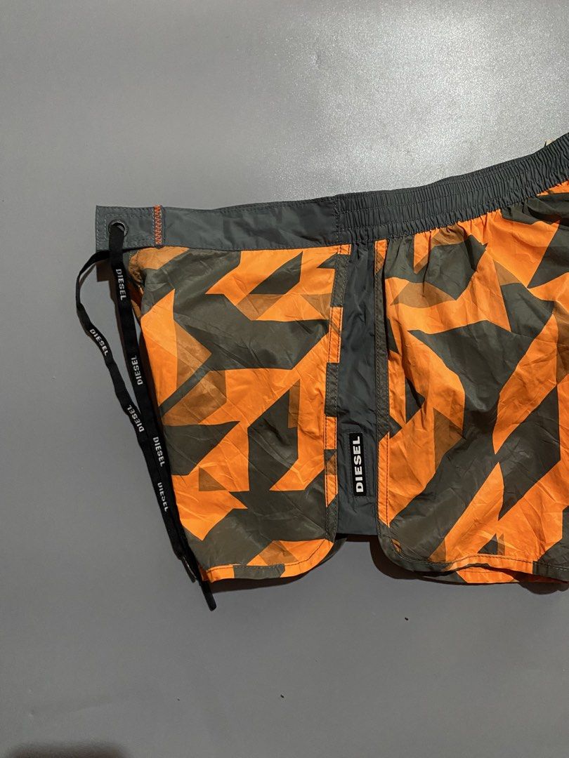 Diesel womens Swim Shorts (Category: Shorts) located in Manila. Submitted by delunakenn94368 (Listing ID 1459847698, Image 3). Description: - Diesel beachwear shorts - Cool orange and grey star camouflage pattern - Elastic waistband with drawstring for a comfortable fit - Side pockets - Ideal for the beach or pool - Get ready for summer in style!.