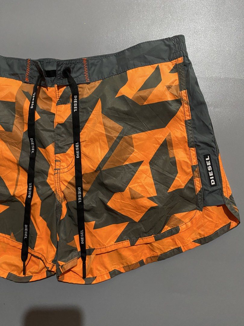 Diesel womens Swim Shorts (Category: Shorts) located in Manila. Submitted by delunakenn94368 (Listing ID 1459847698, Image 2). Description: - Diesel beachwear shorts - Cool orange and grey star camouflage pattern - Elastic waistband with drawstring for a comfortable fit - Side pockets - Ideal for the beach or pool - Get ready for summer in style!.