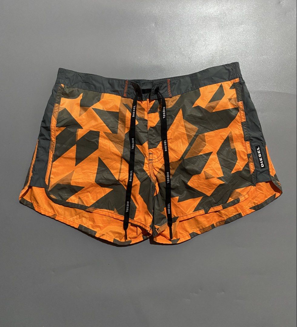 Diesel womens Swim Shorts (Category: Shorts) located in Manila. Submitted by delunakenn94368 (Listing ID 1459847698, Image 1). Description: - Diesel beachwear shorts - Cool orange and grey star camouflage pattern - Elastic waistband with drawstring for a comfortable fit - Side pockets - Ideal for the beach or pool - Get ready for summer in style!.