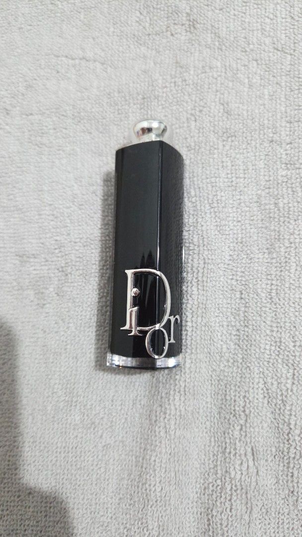 Dior Iconic Lipstick - Shade 720 (Icone) (Category: Makeup) located in Taguig. Submitted by tipidd (Listing ID 1459737554, Image 1). Description: - Authentic Dior Iconic Lipstick - Shade: 720 (Icone) - Features: Iconic black case with silver 'CD' logo - Texture: Smooth application - Versatile: Ideal for everyday wear or evening events - Condition: Comes with original case.