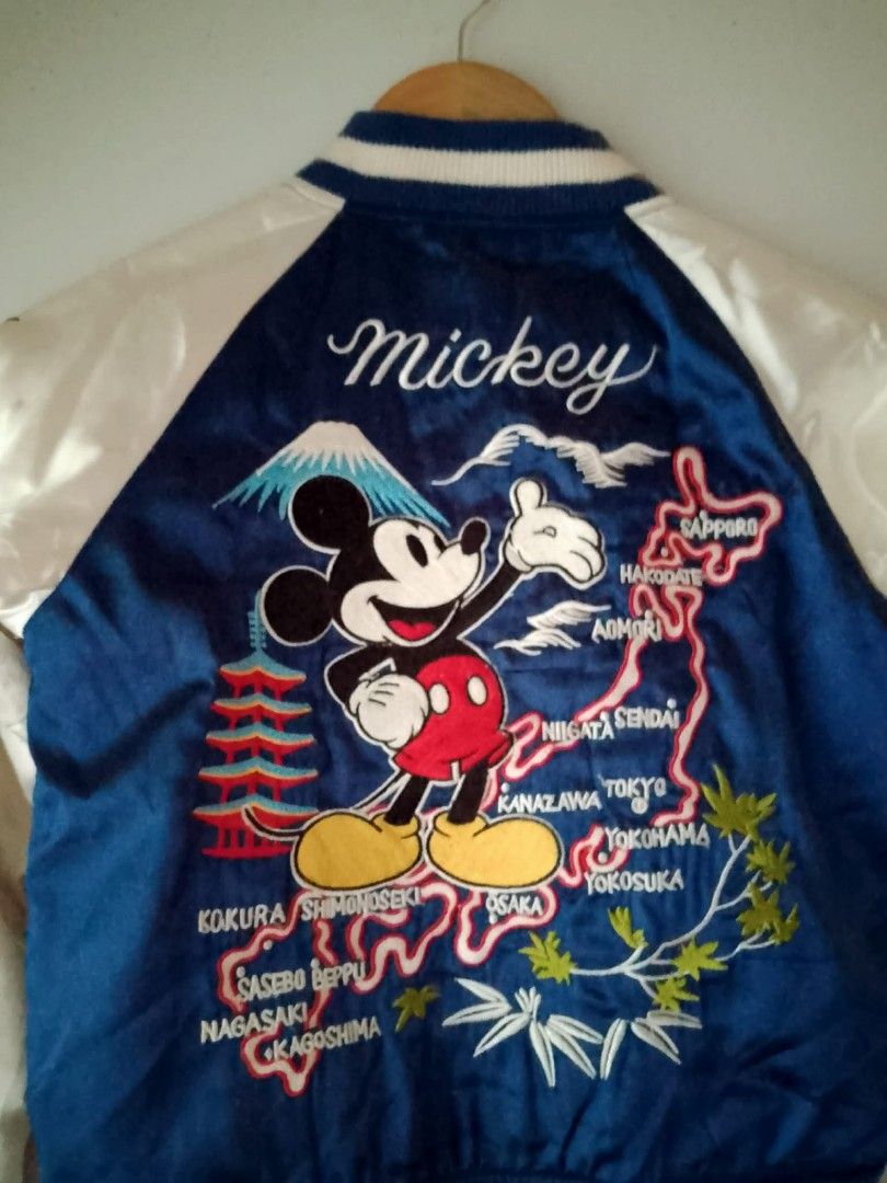Disney Mickey Mouse Japan Souvenir Bomber Jacket (Category: Coats, Jackets and Outerwear) located in Manila. Submitted by romeoamoro00044 (Listing ID 1459784399, Image 3). Description: - Cool Mickey Mouse bomber jacket - Features Japan map embroidery with Mount Fuji and traditional Japanese elements - Made of satin material - Raglan sleeves with dragon embroidery - Ribbed collar, cuffs, and hem - Perfect for Disney fans and collector's for kids.