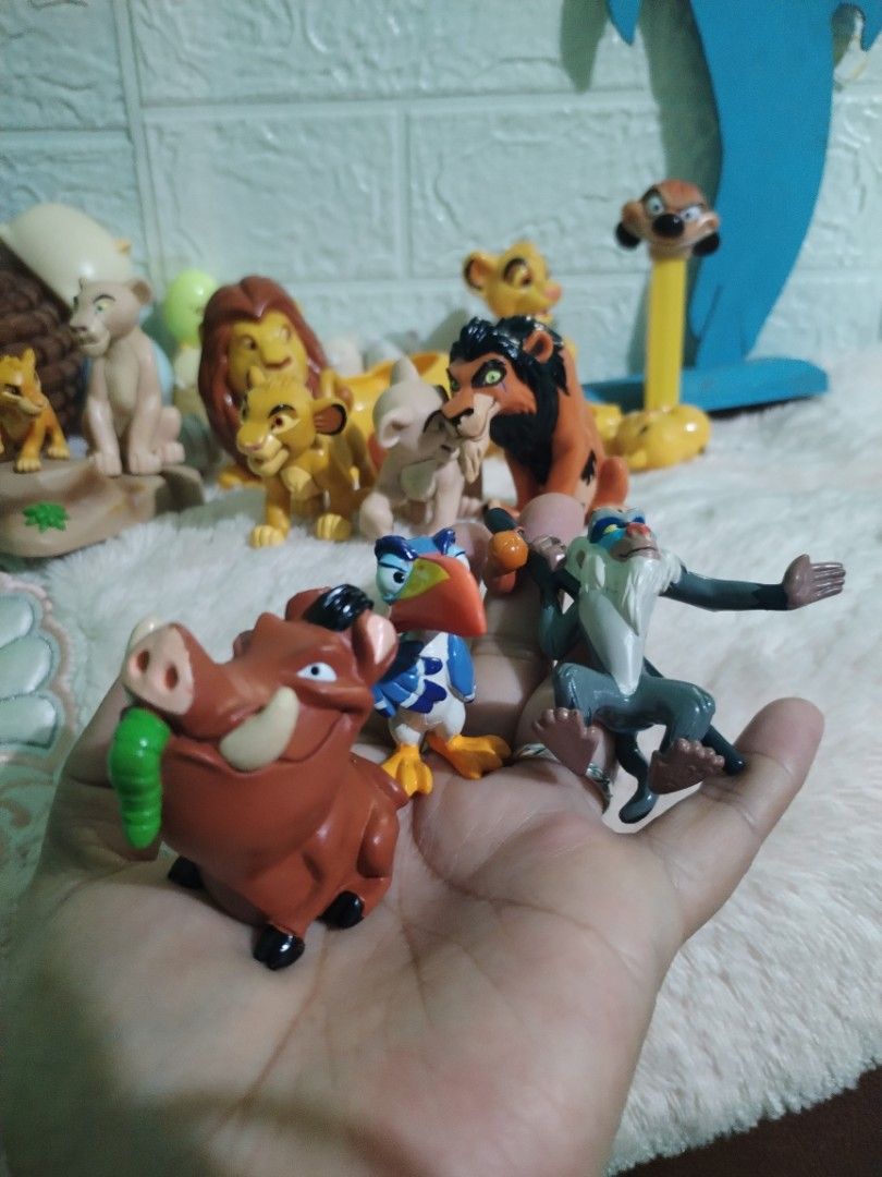 Disney The Lion King Figurines Set (Category: Figurines & Statues) located in Manila. Submitted by malditas (Listing ID 1459807377, Image 2). Description: - Complete The Lion King character figurine collection - Includes Simba, Mufasa, Scar, Nala, Timon, Pumbaa, and Zazu - Some figurines feature official Disney branding - Ideal for The Lion King collectors and fans - Great for display or imaginative play.