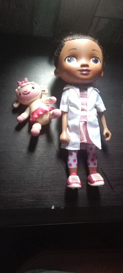 Doc McStuffins Doll and Lambie Toy Set (Category: Kids Toys) located in Manila. Submitted by ysa_hades (Listing ID 1459896182, Image 1). Description: - Doc McStuffins doll with her friend Lambie. - Doc is dressed in her doctor's coat, striped shirt, polka dot leggings, and pink sneakers. - Lambie is wearing a cute pink tutu. - Ideal for imaginative and pretend play..