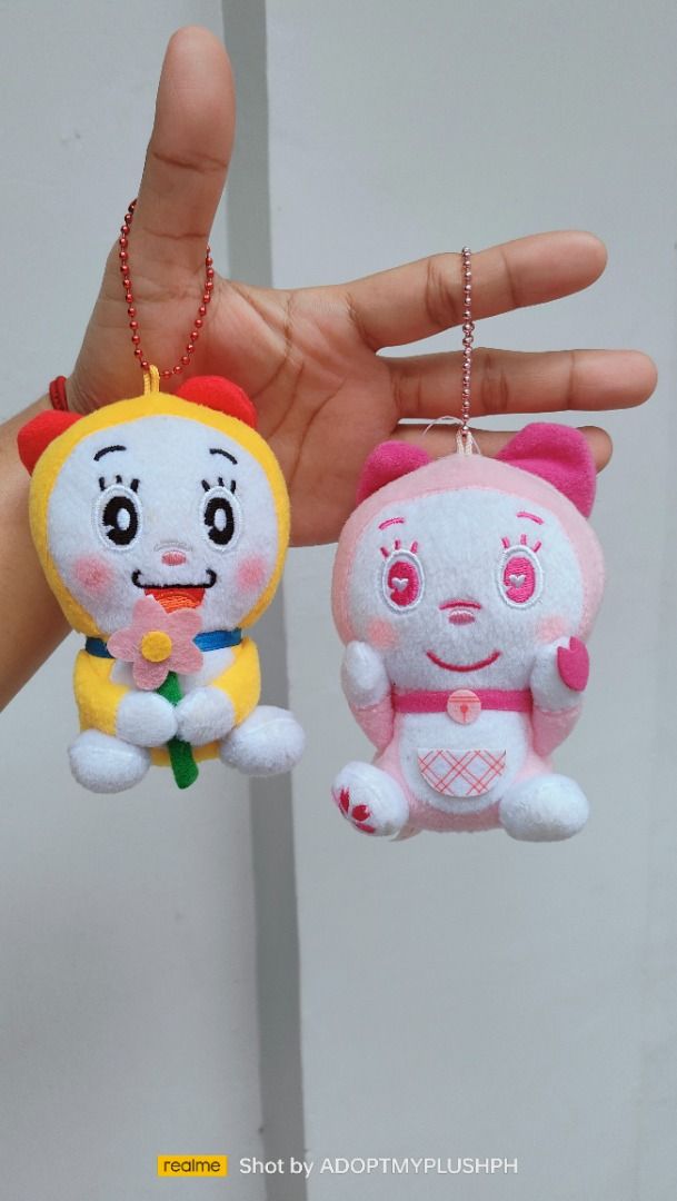 Dorami-chan Doraemon Plush Keychain Charms (Category: Plushies & Soft Toys) located in Taguig. Submitted by adopt.my.plush.ph (Listing ID 1459897572, Image 1). Description: 160.00 each Dorami-chan mini plush keychain with embroidered details: Classic Dorami holding a pink felt flower Sakura Dorami with heart-shaped eyes and cherry blossom details *as is, WYSIWYG ‼️Photos have been uploaded for your reference. Kindly make sure to review them ALL b