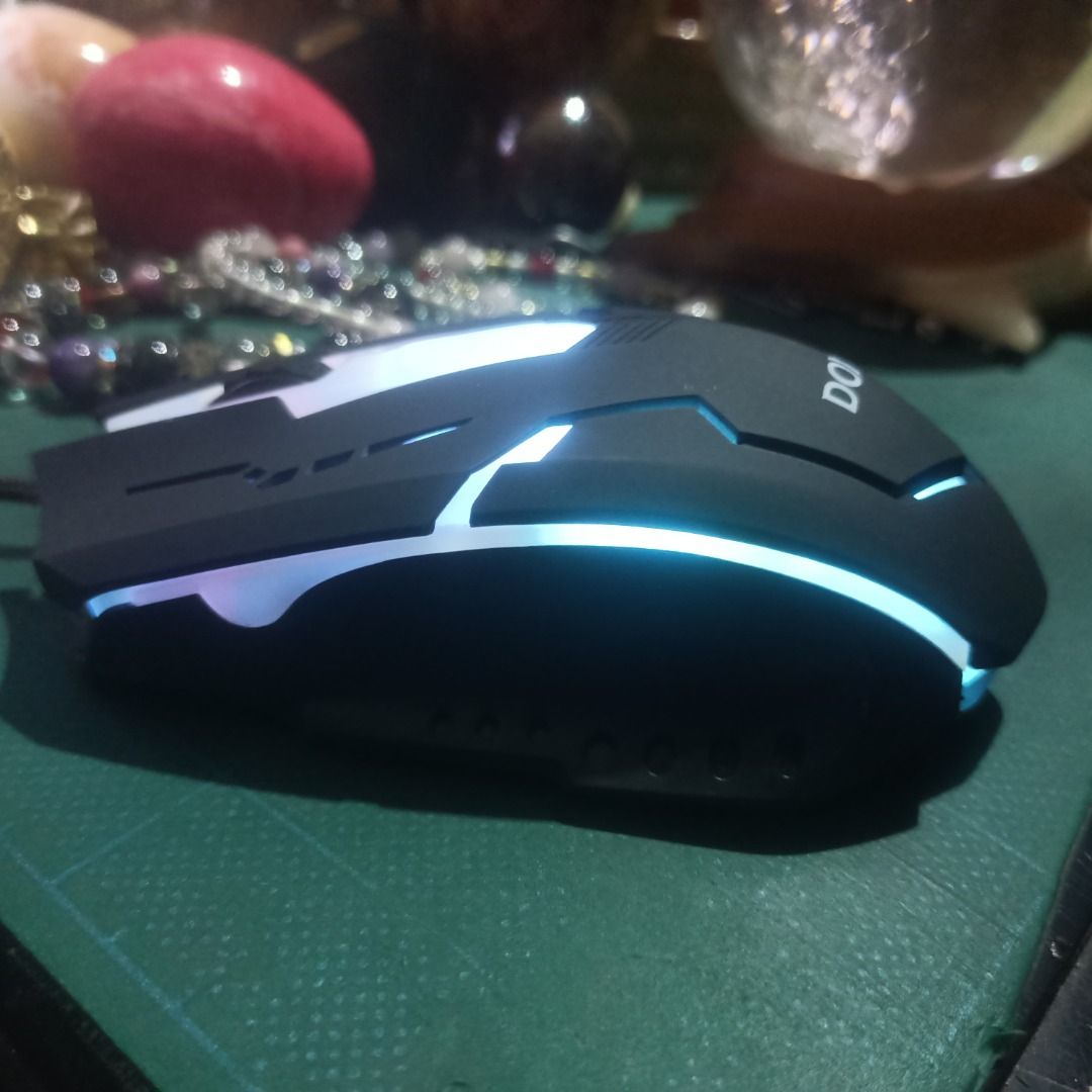 DOXX Wired Gaming Mouse with RGB Lighting (Category: Mouse & Mousepads) located in Munoz. Submitted by larryc1212 (Listing ID 1459815090, Image 3). Description: - DOXX Wired Gaming Mouse - Vibrant RGB lighting effects - Durable braided cable - Plug and play (no software required) - Ideal for gaming and everyday use Disclaimer: Item may include some scratches due to age, as is were is basis Item can be pick up in our Japan surplus shop located in 