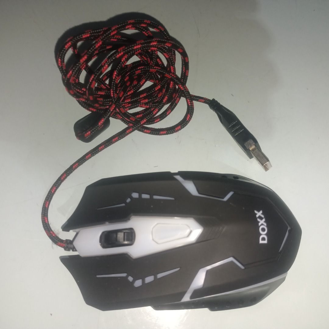 DOXX Wired Gaming Mouse with RGB Lighting (Category: Mouse & Mousepads) located in Munoz. Submitted by larryc1212 (Listing ID 1459815090, Image 2). Description: - DOXX Wired Gaming Mouse - Vibrant RGB lighting effects - Durable braided cable - Plug and play (no software required) - Ideal for gaming and everyday use Disclaimer: Item may include some scratches due to age, as is were is basis Item can be pick up in our Japan surplus shop located in 