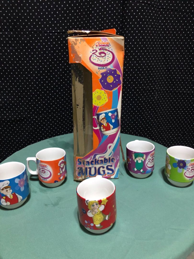 Dunkin' Donuts Stackable Mugs Special Edition Set (Category: Coffee & Tea Tableware) located in Caloocan City. Submitted by depungok (Listing ID 1459884144, Image 2). Description: - Set of 5 Dunkin' Donuts stackable mugs - Special edition packaging - Each mug features a unique, cute character design - Perfect for coffee or tea lovers - Great for collectors or everyday use - Stored in original box.