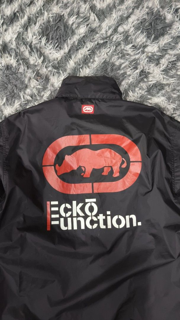 Ecko Function Light Zipper Jacket (Category: Coats, Jackets and Outerwear) located in Klang. Submitted by trussarce.my (Listing ID 1459851089, Image 2). Description: Size XL Arm Pit 25 Length 31 - Black Ecko Function jacket - Iconic rhino logo on the back - Zip-up front with pockets - Striped detailing on sleeves and collar - Ideal for casual wear.