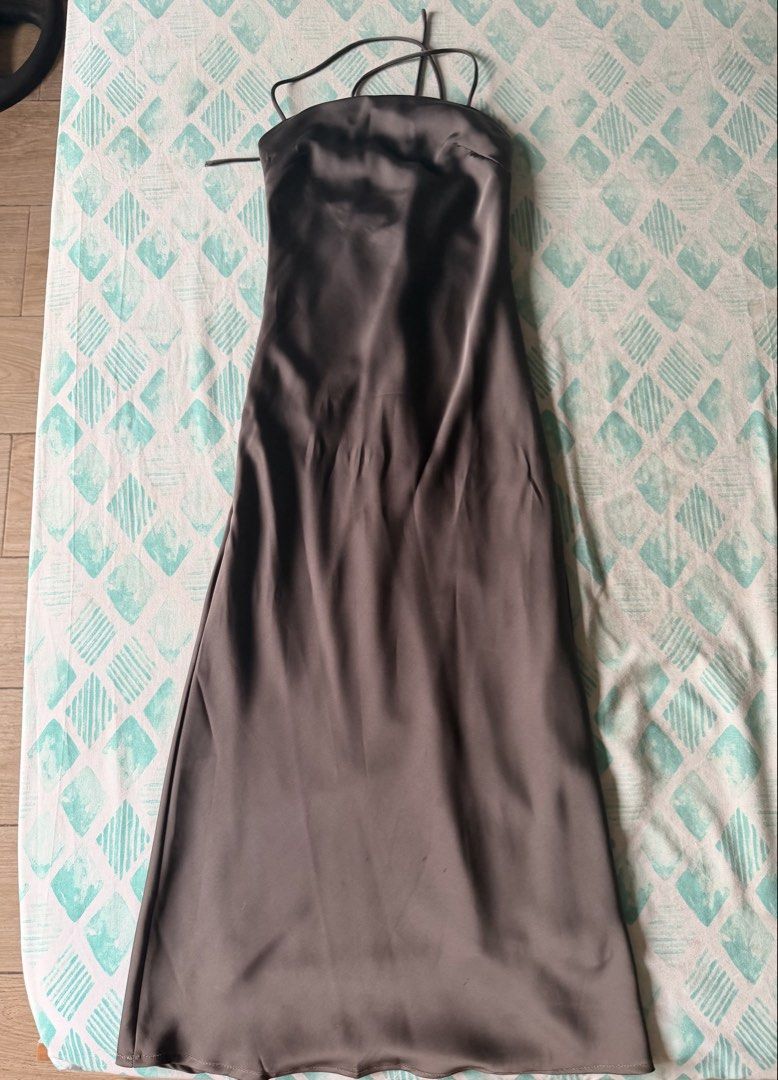 Editor’s Market Satin Dress (Category: Dresses) located in Navotas City. Submitted by thrifty.16 (Listing ID 1459699677, Image 2). Description: NEGOTIABLE‼️ - Chic grey satin slip dress - Midi length - Delicate spaghetti straps - Flattering tie detail at the bust - Ideal for a night out or special occasion - Reason for selling: no longer fits - Measurements available in photos .