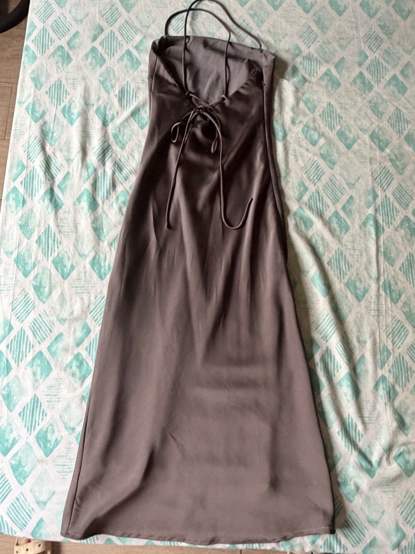 Editor’s Market Satin Dress (Category: Dresses) located in Navotas City. Submitted by thrifty.16 (Listing ID 1459699677, Image 3). Description: NEGOTIABLE‼️ - Chic grey satin slip dress - Midi length - Delicate spaghetti straps - Flattering tie detail at the bust - Ideal for a night out or special occasion - Reason for selling: no longer fits - Measurements available in photos .