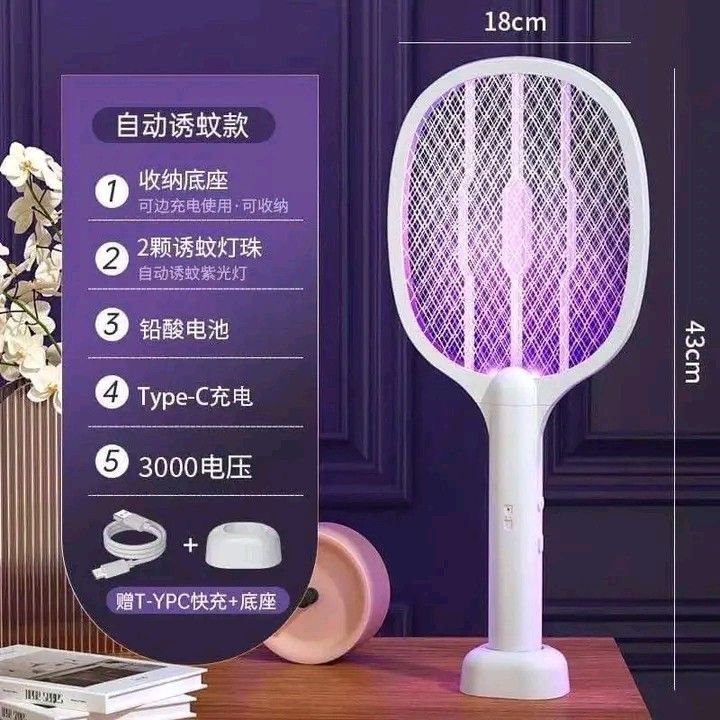 Electric Mosquito Swatter with UV Light & Charging Base (Category: Lighting) located in Manila. Submitted by berdenmarl01688 (Listing ID 1459886863, Image 2). Description: - Say goodbye to mosquitoes and flies! - Dual-mode electric swatter: Manual swatting & automatic UV killer. - 8 UV lamp beads attract and zap bugs automatically. - Powerful voltage with a safe outer net. - Rechargeable via Type-C, includes charging base. - Compact size: 18cm x 