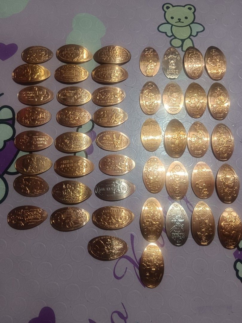 Elongated souvenir medal token (Category: Character Goods) located in Pasig City. Submitted by rednaxela_rich (Listing ID 1459794702, Image 1). Description: 46pcs assorted Disney elongated souvenir medal token sanrio/Tokyo Disneyland.