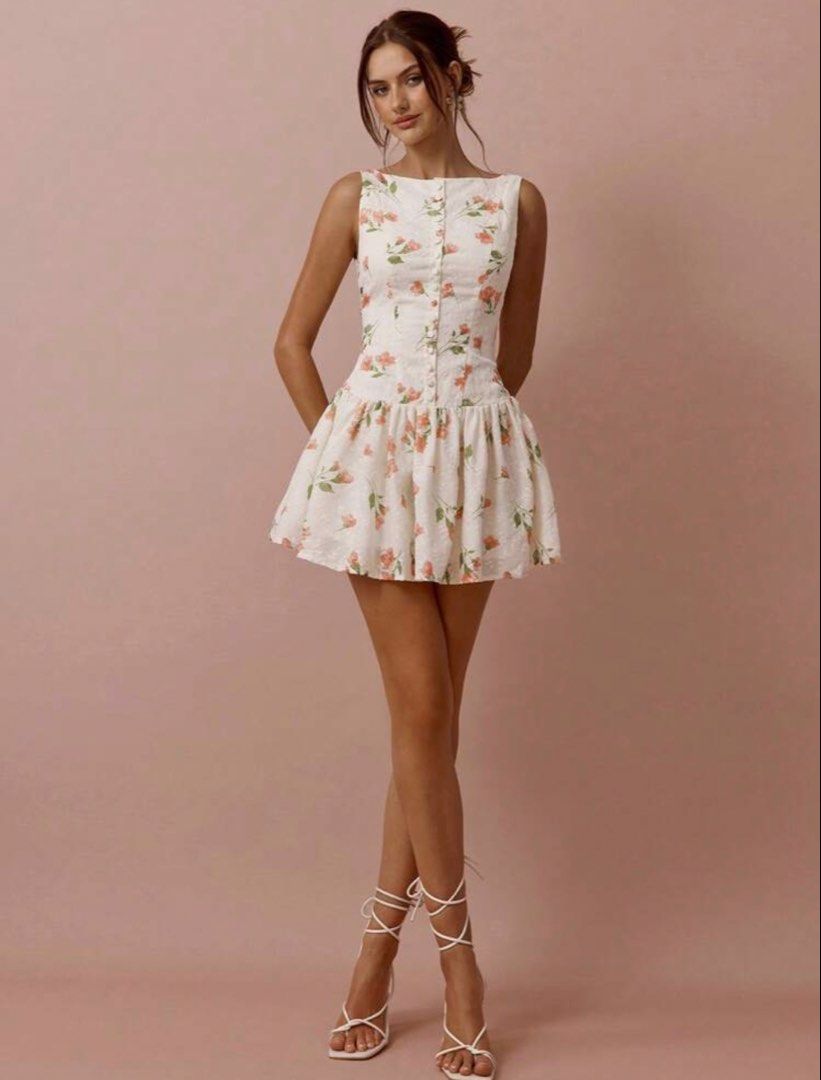 Shein Floral Button-Up Mini Dress (Category: Dresses) located in Las Pinas. Submitted by fabmommas (Listing ID 1459807729, Image 1). Description: - Used once - Cute white mini dress - Adorable floral print - Sleeveless design - Button-up front - Flared skirt for a playful look - Ideal for summer outings and parties - Versatile: pair with sandals or heels.