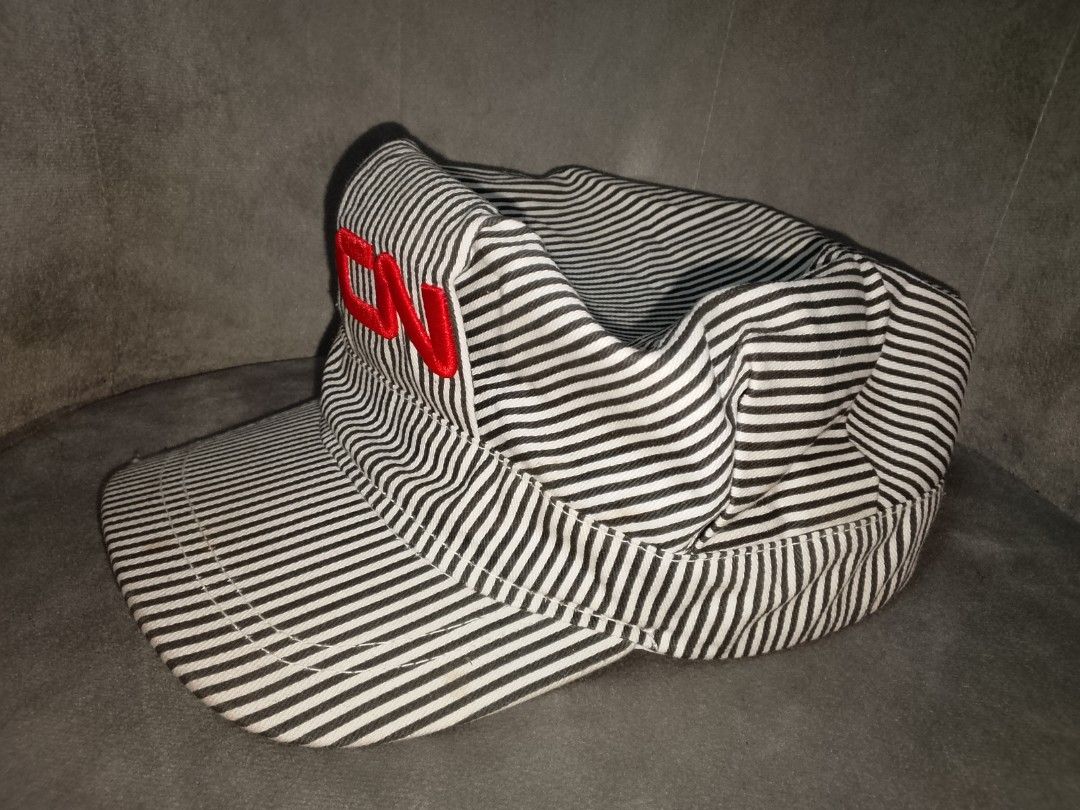 Engineer/Conductor Hat (Category: Caps & Hats) located in Binangonan. Submitted by yuristalin888 (Listing ID 1459846642, Image 3). Description: This classic black-and-white hickory stripe engineer/conductor cap features a structured high crown with red embroidered "CN" lettering on the front, a stiff curved brim, and an adjustable white plastic snapback closure in the back. NEEDS WASH!.