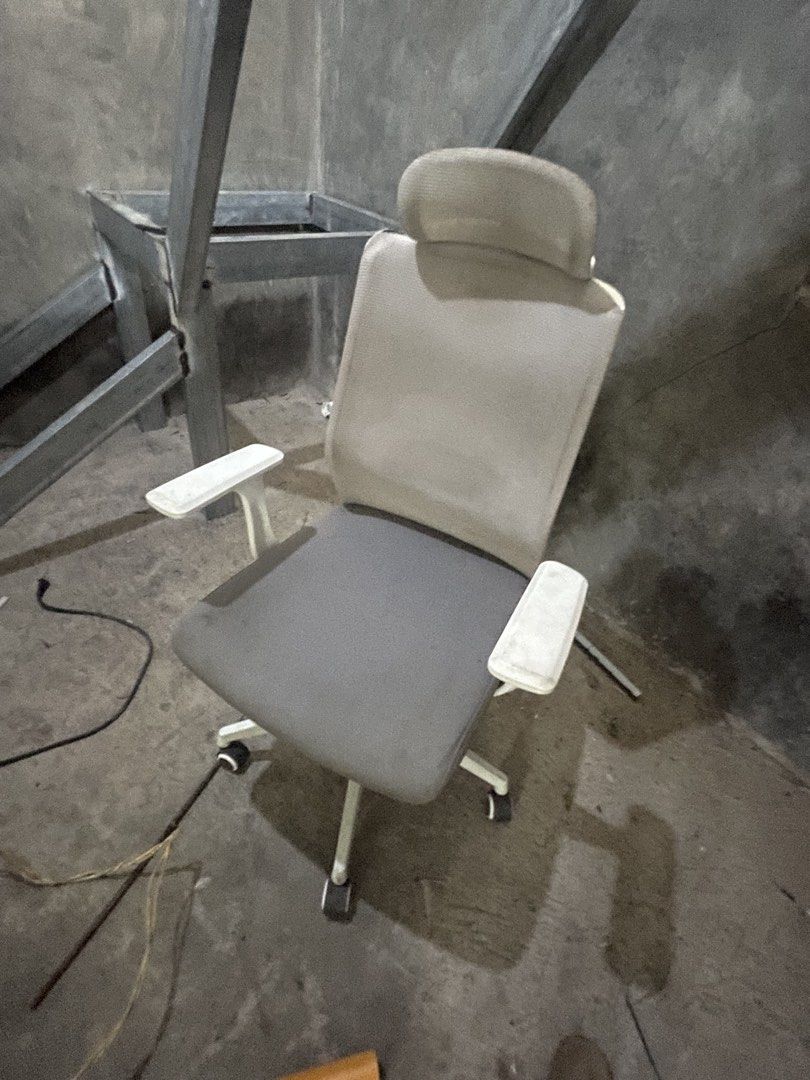 Ergonomic Office Chair with Headrest (Category: Office Furniture & Fixtures) located in Manila. Submitted by yuri_fcb1ca (Listing ID 1459723073, Image 1). Description: - Grey ergonomic office chair - Adjustable armrests and headrest for extra support - Swivels and rolls smoothly on casters - Ideal for long hours at your desk - Minor scuffs on armrests - Overall in good working condition.