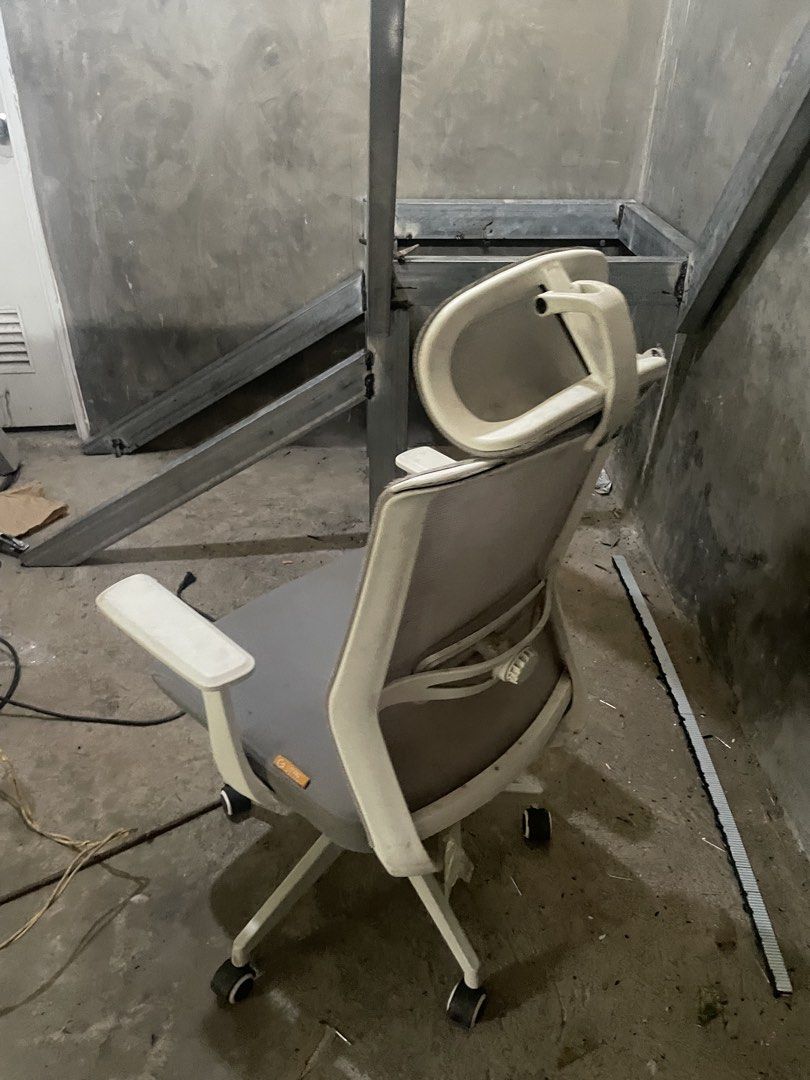 Ergonomic Office Chair with Headrest (Category: Office Furniture & Fixtures) located in Manila. Submitted by yuri_fcb1ca (Listing ID 1459723073, Image 2). Description: - Grey ergonomic office chair - Adjustable armrests and headrest for extra support - Swivels and rolls smoothly on casters - Ideal for long hours at your desk - Minor scuffs on armrests - Overall in good working condition.