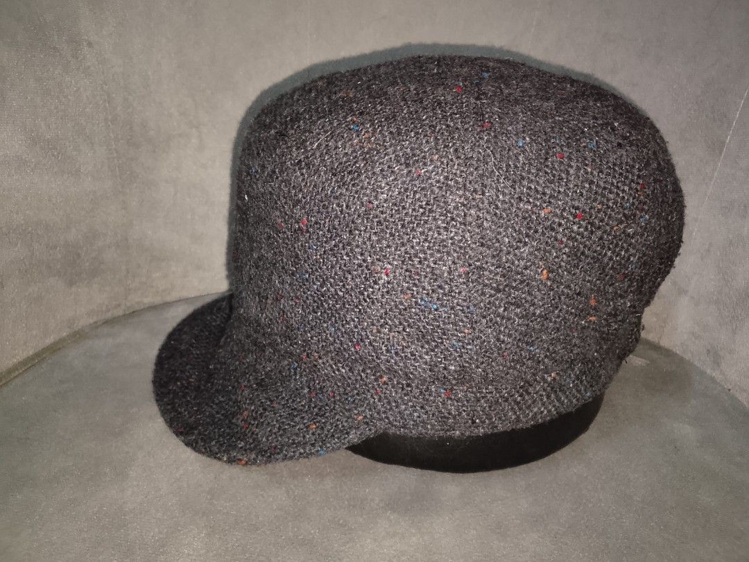 ESPRIT Softbrim Military/Cadet Style Cap (Category: Hats & Beanies) located in Binangonan. Submitted by yuristalin888 (Listing ID 1459827430, Image 3). Description: This dark grey tweed-style cadet/military cap is crafted from a textured woolen fabric featuring multicolored speckles throughout. It features a structured flat-top crown and a softbrim, accented on the side with a circular metallic button bearing the **ESPRIT** logo..