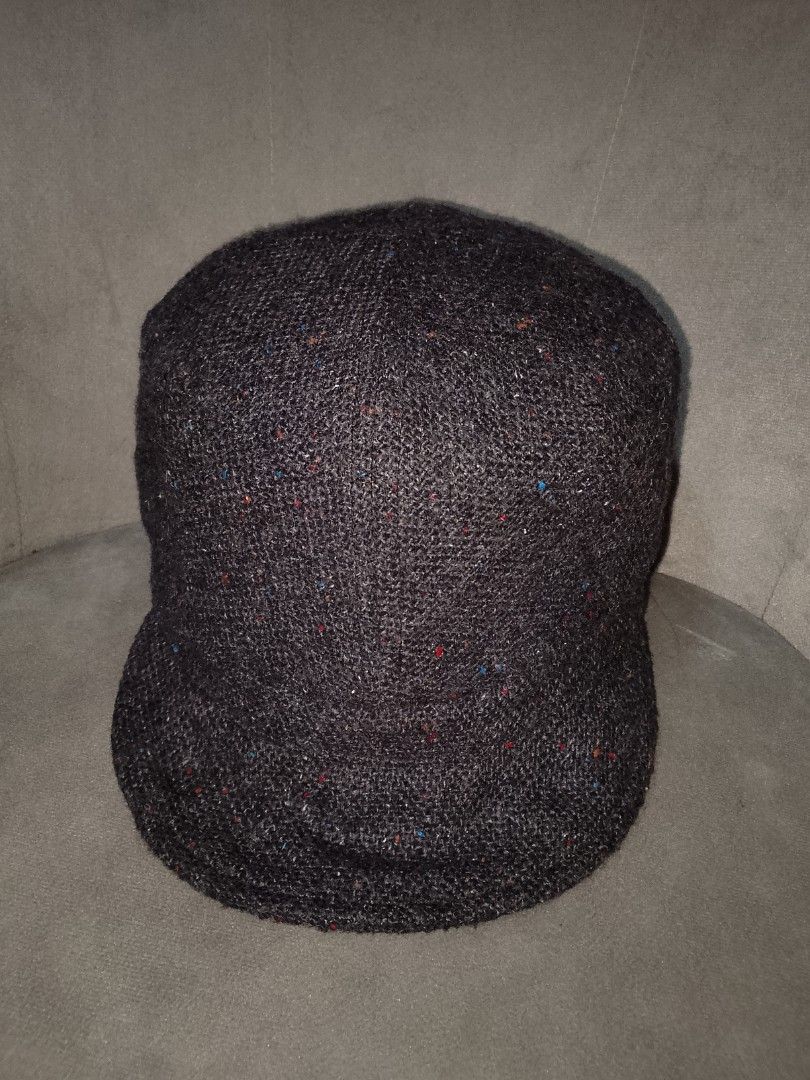 ESPRIT Softbrim Military/Cadet Style Cap (Category: Hats & Beanies) located in Binangonan. Submitted by yuristalin888 (Listing ID 1459827430, Image 2). Description: This dark grey tweed-style cadet/military cap is crafted from a textured woolen fabric featuring multicolored speckles throughout. It features a structured flat-top crown and a softbrim, accented on the side with a circular metallic button bearing the **ESPRIT** logo..