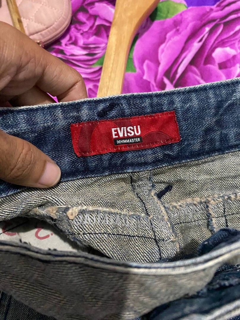 EVISU Denim Skirt Size 28 (Category: Skirts) located in San Rafael. Submitted by _foundbyk (Listing ID 1459808991, Image 3). Description: - Evisu Denim Skirt - Size: 28 - Color: Blue distressed denim - Features: Pleated details at the front - Style: Unique - Condition: Please check photos for details.
