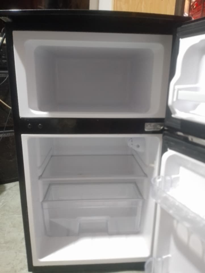 Ezy Direct Cool Mini Fridge (Category: Refrigerators and Freezers) located in Manila. Submitted by cryzylkzlnt (Listing ID 1459889611, Image 2). Description: - Compact Ezy mini fridge - Manual defrost - Keeps food fresh and cool - Energy saving design - Ideal for small spaces (dorm rooms, offices) - Features two shelves and door storage - Dark grey exterior.