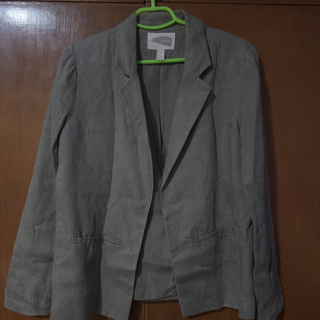 F21 Linen Blend Blazer (Category: Coats, Jackets and Outerwear) located in Paranaque City. Submitted by goldenlara (Listing ID 1459841128, Image 1). Description: - Lightweight linen blend blazer - Neutral green color - Buttonless front with puff shoulder detail - Two front pockets but not working pockets - Versatile for work or casual outfits.