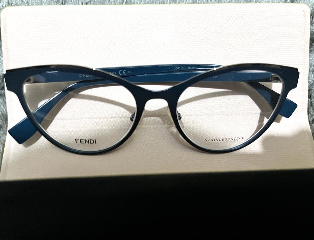 Fendi Navy Blue Cateye eyeglasses (Category: Luxury Accessories) located in Marikina City. Submitted by itsmejerome3030 (Listing ID 1459805204, Image 3). Description: Brand: Fendi Size: 53-17-140 (53mm lens width, 17mm bridge width, and 140mm temple arm length) Color: Navy Blue Issue: None Inclusion: Authenticity card, original case and cleaning cloth PS I’ll make sure shipped items are presentable, however kindly manage your expectations since i