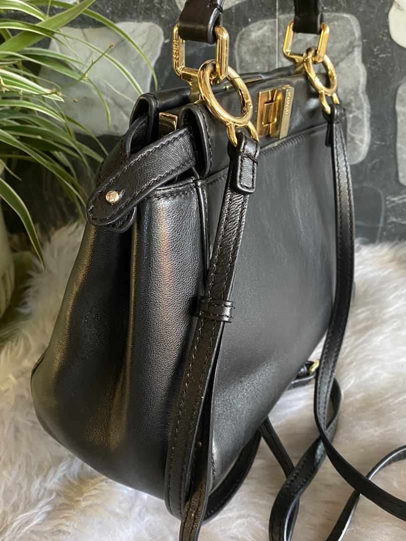 Fendi Peekaboo Black Leather Mini Handbag (Category: Luxury Bags & Wallets) located in Bacolod City. Submitted by chuchaystuffs (Listing ID 1459742283, Image 2). Description: - Fendi Peekaboo Bag - Color: Black Leather - Size: Mini - Hardware: Gold - Features: Detachable shoulder strap, interior zip pocket - Condition: Clean inside and out - Perfect for daily use or special events - self authentication pro “parang” orig po Sya.