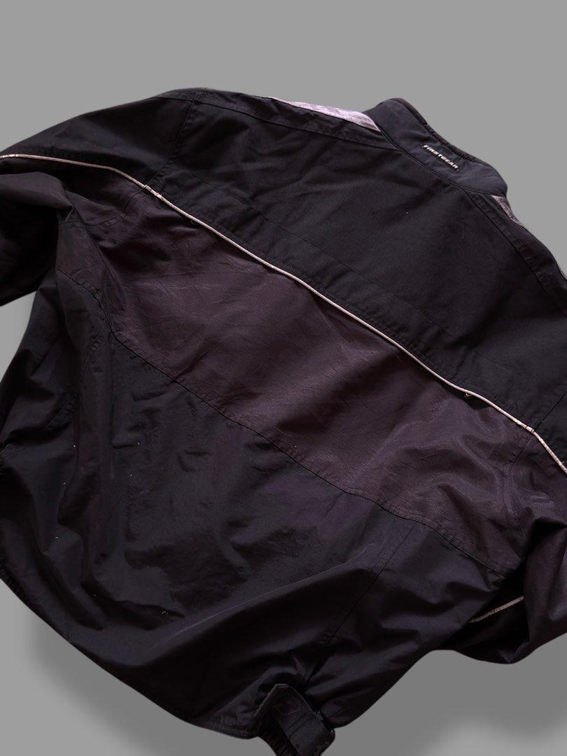 Firstgear Motorcycle Jacket (Category: Coats, Jackets and Outerwear) located in Pulilan. Submitted by _sevegn (Listing ID 1459852740, Image 2). Description: - Black and grey Firstgear motorcycle jacket - Multiple pockets on the front - Reflective piping along sleeves and back - Zipper closure - Ideal for motorcycle riding.