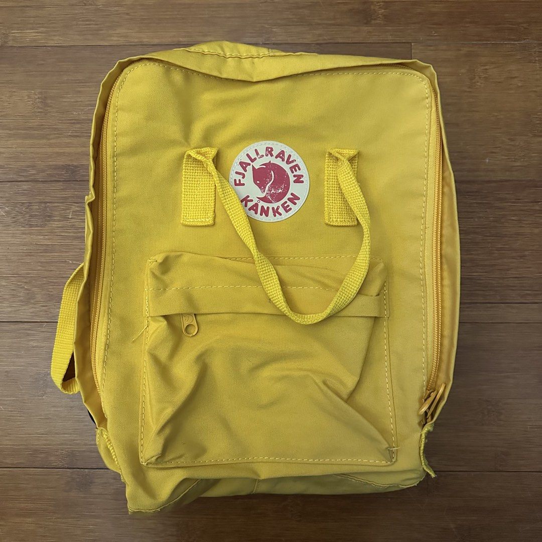 Fjallraven Kanken Backpack Yellow (Category: Backpacks) located in Manila. Submitted by wellprelovedthings (Listing ID 1459794627, Image 1). Description: Durable and water-resistant material Features a front zip pocket and spacious main compartment Easy to clean and maintain College bag Bought in Japan, year 2019.